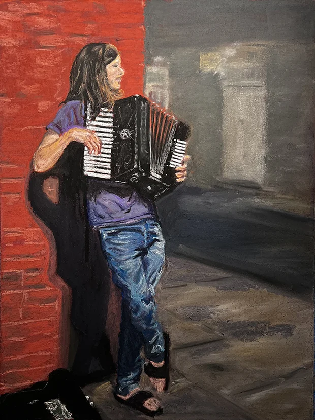 Accordionist busking on a New Orleans night.