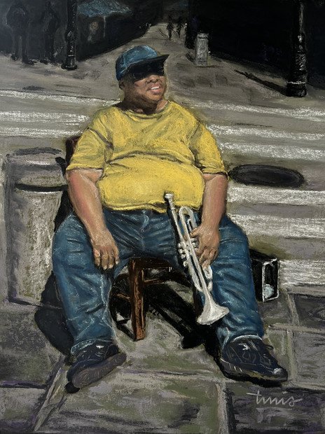 New Orleans, Lousiana street musician resting with trumpet.